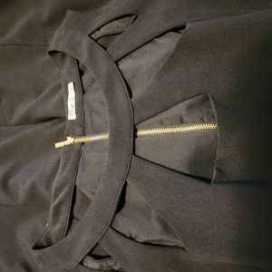 Sleeveless party dress with tasteful and stylish cutout neckline and back zipper